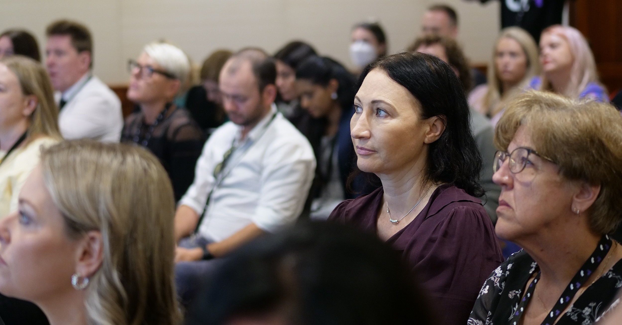 teachers watching a presentation at the QTiP conference