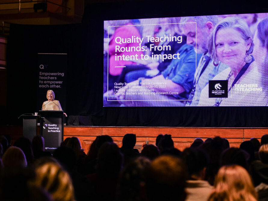 Jenny Gore on stage presenting her keynote.