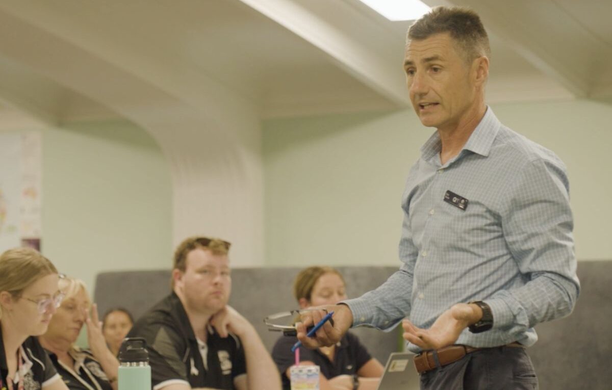 A QT Adviser presenting to a group of teachers.