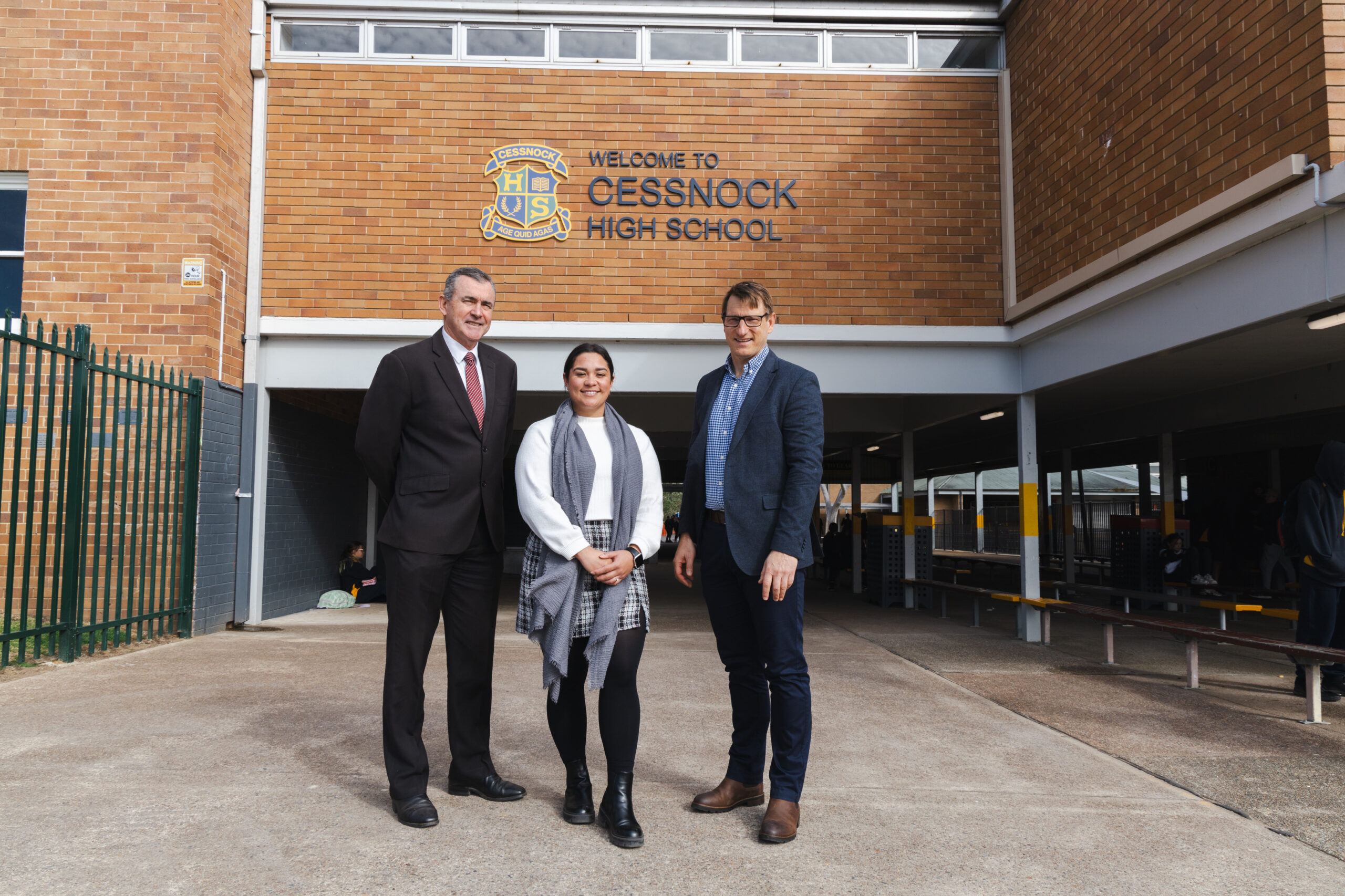 Cessnock High School Principal and teacher standing with Dr Drew Miller.